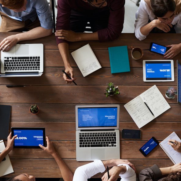 top-view-photo-of-people-near-wooden-table-3183150 copia